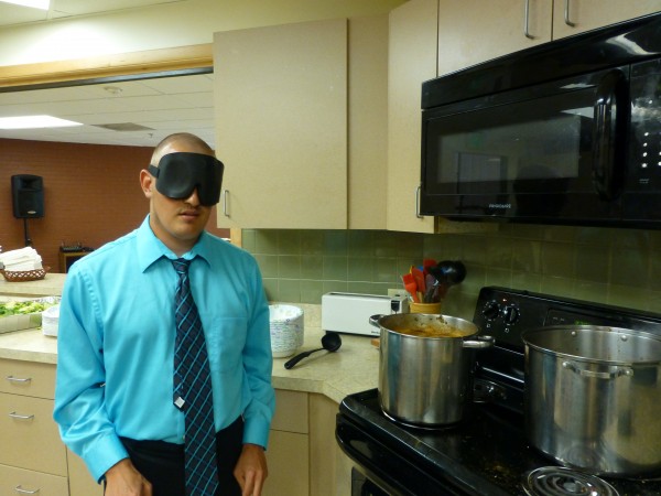 Andy readying his soup to be served