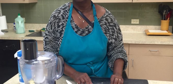 a woman prepares a salad.