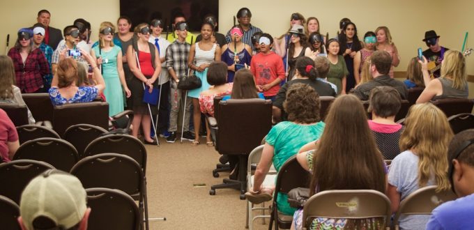 Students and counselors lined up in choir fashion singing