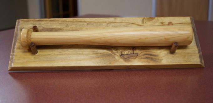 a miniature baseball bat with the CCB logo as trademark