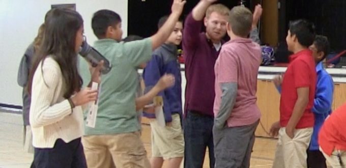 Ryan High-Fives with the students after shooting some hoops