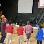 Ryan shoots some hoops with a group of students from Mile High Academy