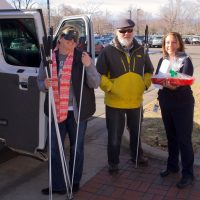 Dan and Libby give a tray of goodies to a representative from the City Planner's Office