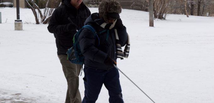 Martin and Lynne walking in the snow. You can see the steam from Martin's breathing