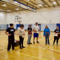 Martial Arts with their orange belts and certificates