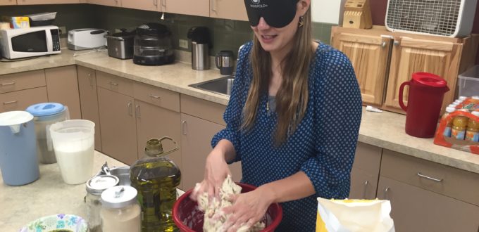 Tabea kneads dough with both hands