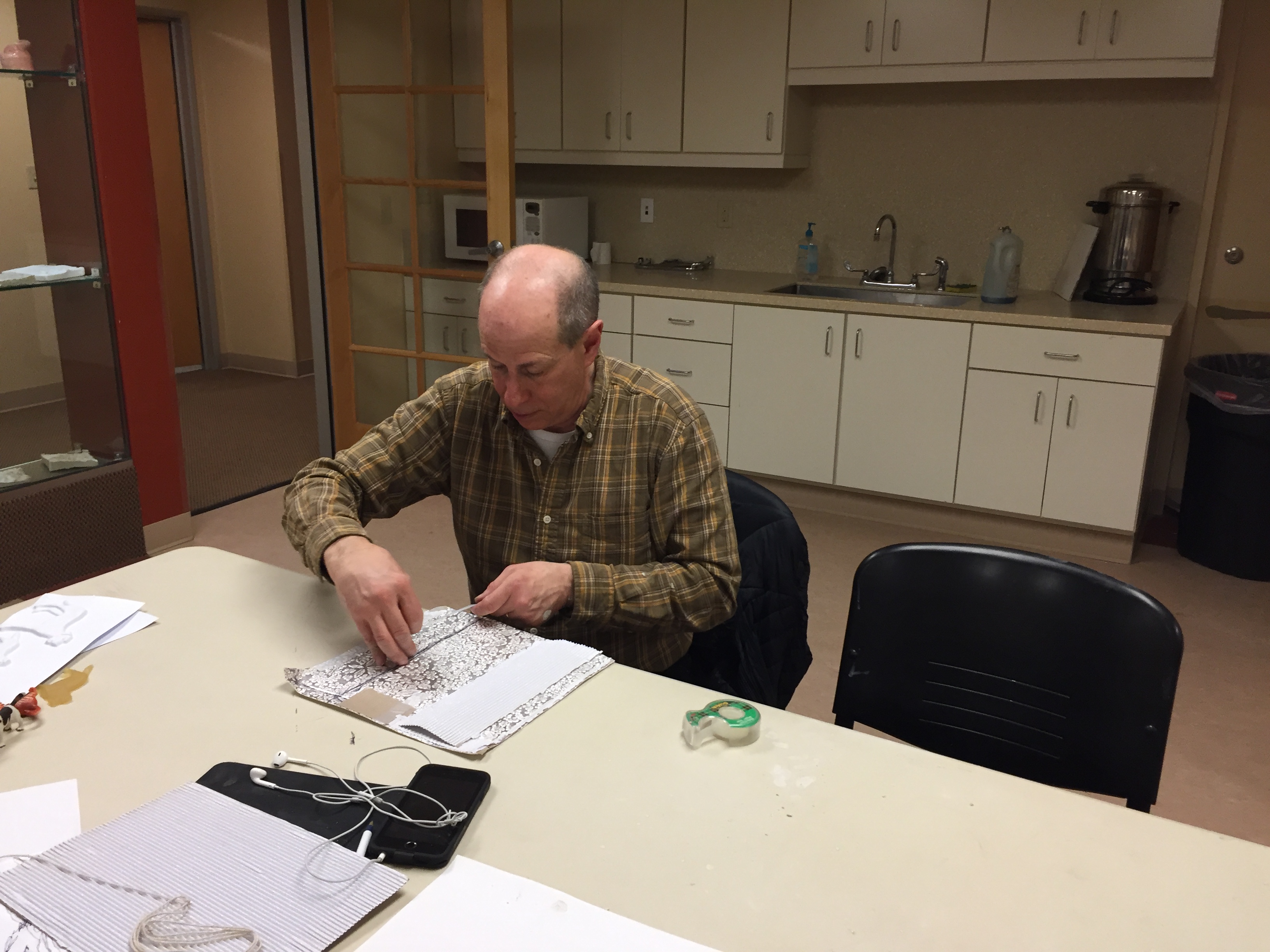 Peter exploring the paper's textures with his fingers