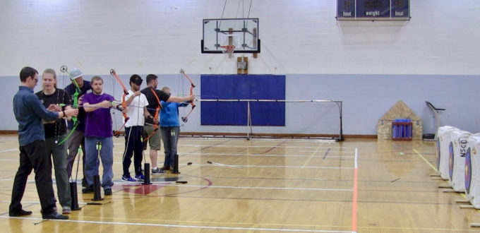 Petr K., Mike B. Chaz and C.G. Aiming their Bows at the Archery Firing line with NCSD Instructors