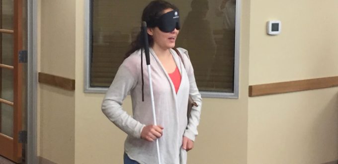 Ceci in sleepshades answering questions from visitors
