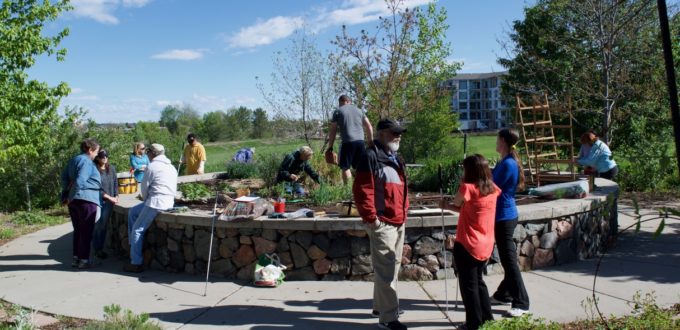A large group working out in the garden