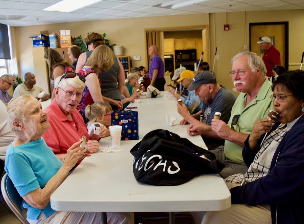 Diane witha group of seniors enjoying ice cream