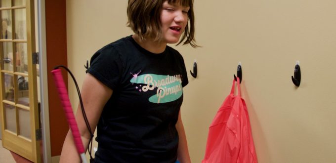 Cadence shows how to tell which one is her Backpack on the hooks