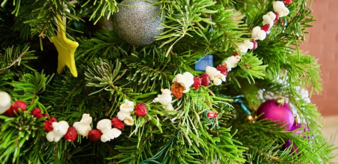 CCB Tree decorated with hand made ornaments and strings of popcorn and cranberries