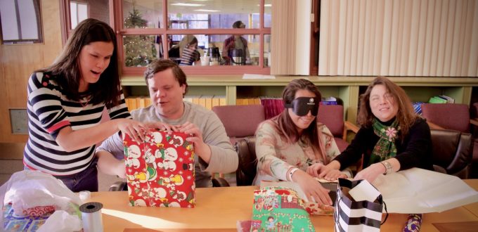 Stephannie, Brett, Myra and Delfina wrap presents