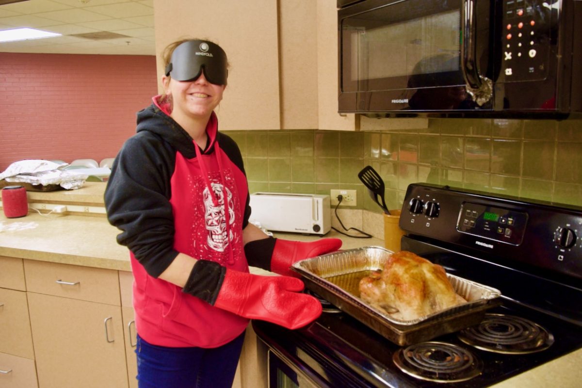 Emily with a golden-brown Turkey she just took out of the oven