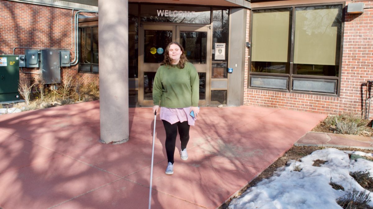 Holly headed out from the Center with her cane
